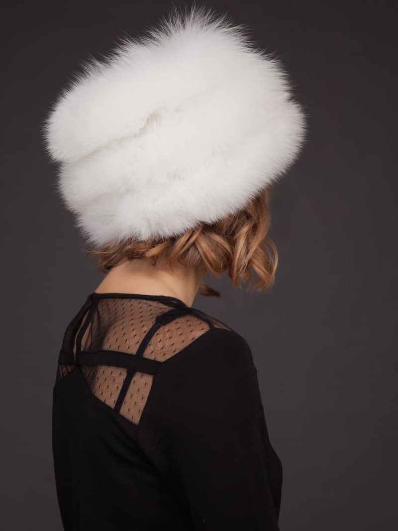 White fox fur hat with leather inserts and flat top