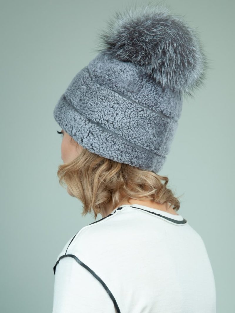 blue sheepskin fur hat with fox pom pom for women