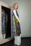gray astrakhan karakul fur vest with yellow chinchilla pocket decoration