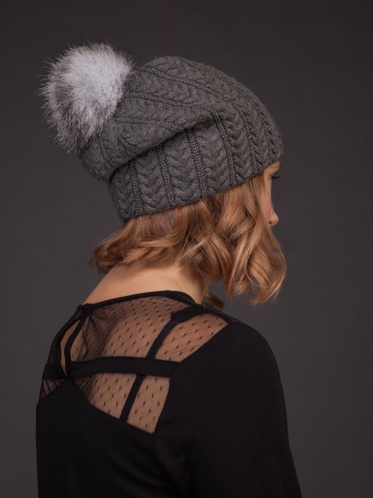 Dark grey nordic knit wool hat with fox pom