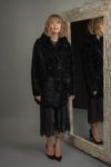 medium-length black sheepskin fur coat