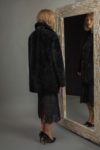 medium-length black sheepskin fur coat