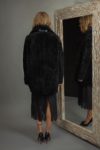 medium-length black sheepskin fur coat