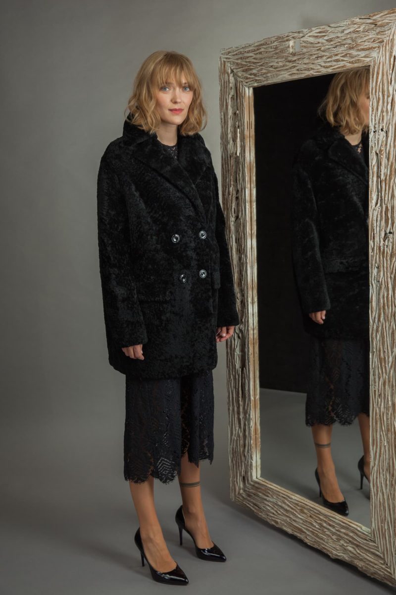 medium-length black sheepskin fur coat