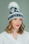 wool hat with fur pom-pom in dark blue Santa deer pattern in white background