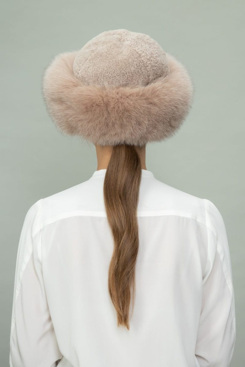 brown fox fur and beige sheepskin hat