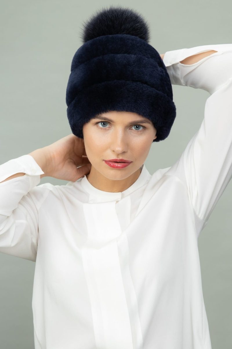 dark blue mouton fur hat with fox fur pom-pom