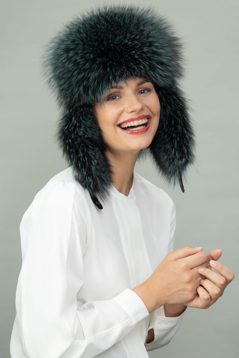 green fox fur and puffy hat with ear flaps