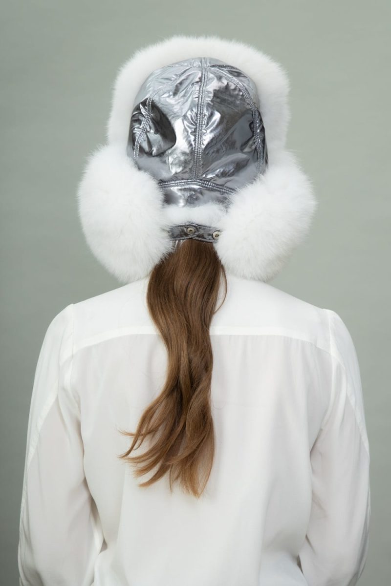 white fox fur and silver puffy hat with ear flaps
